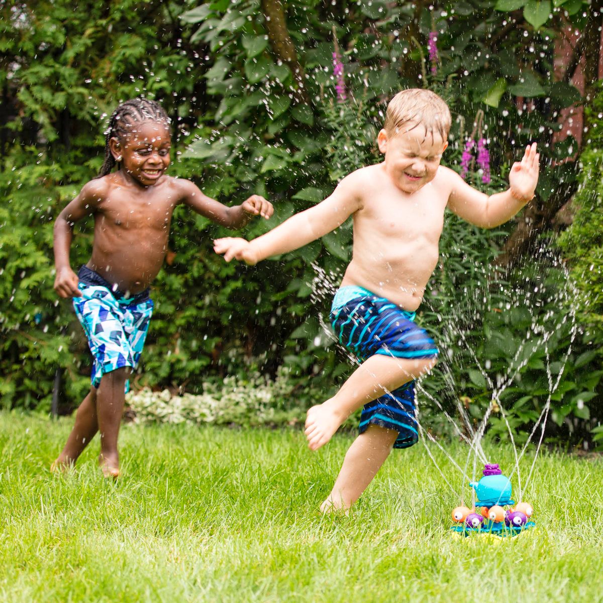 Kids playing in store sprinkler