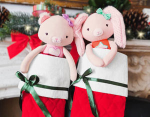 Two plush dolls in stockings.