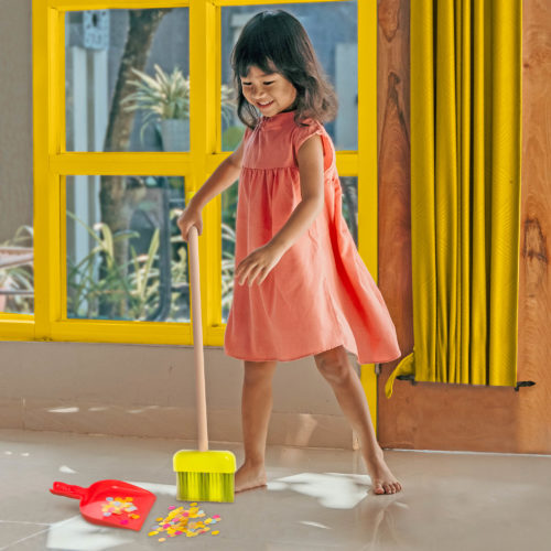 Girl with cleaning toys.