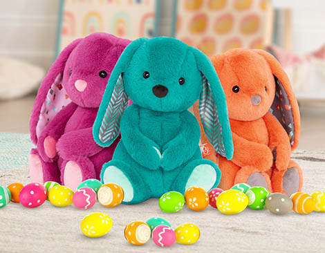 Plush bunnies with Easter eggs.