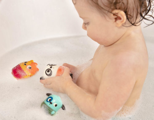 Baby in bath with water squirts.